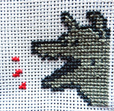 Un chien au point de croix